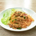 glass noodle with pork spicy salad and lettuce on plate 220843655