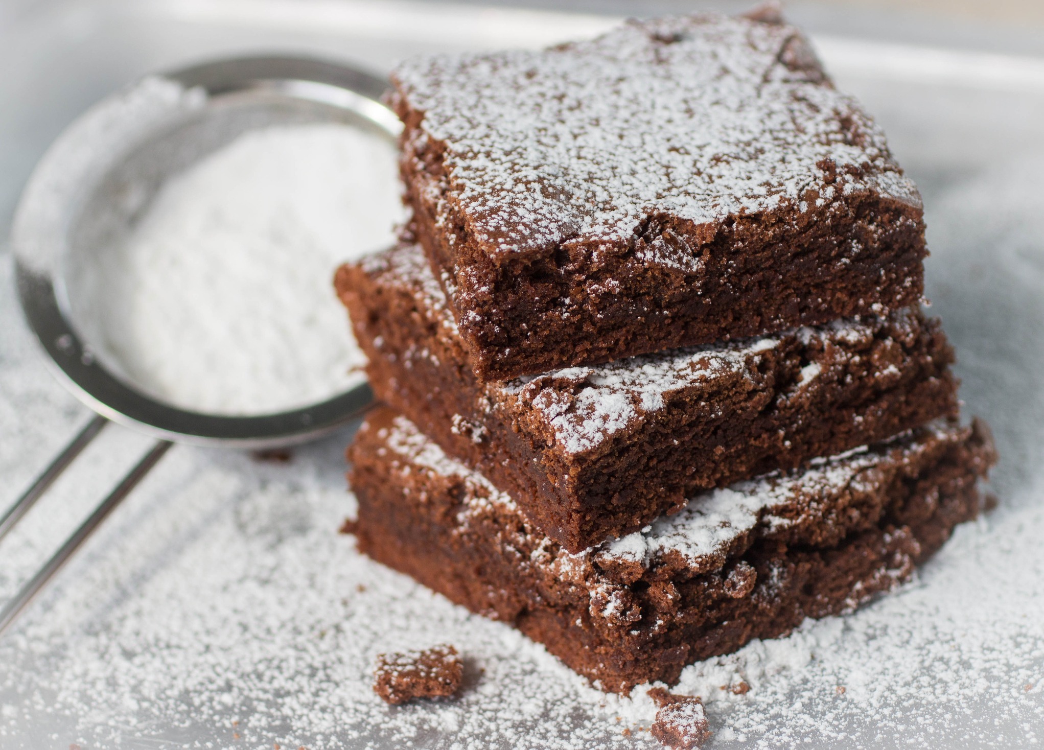 brownie chocolate cakes with powdered sugar 64332511