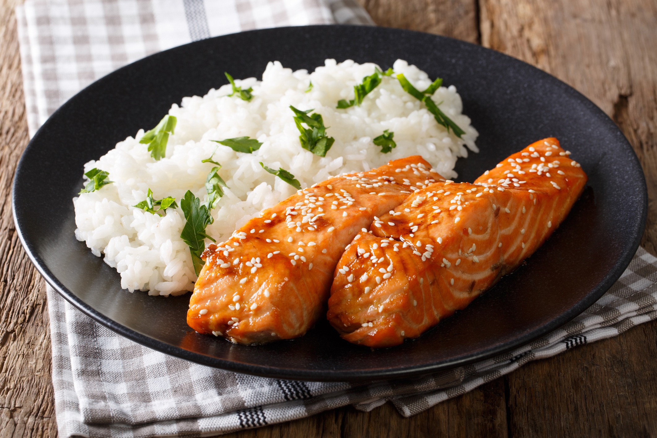 fried salmon in a honey soy glaze and rice close up horizontal 90918189