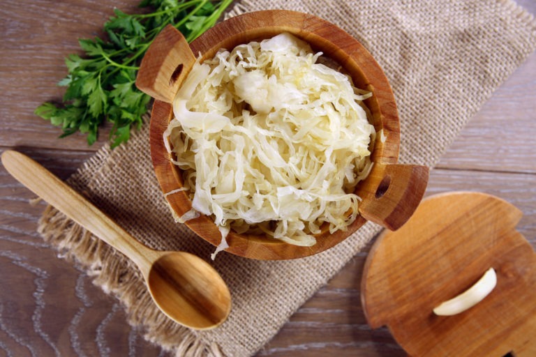 sauerkraut in a wooden barrel 44960203 scaled