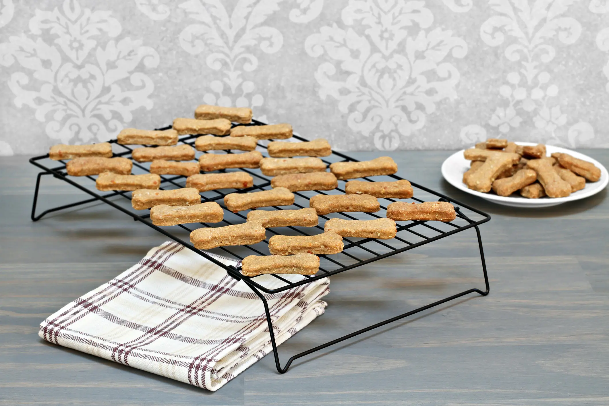 homemade healthy dog bones cooling on a metal rack selective f 58680360